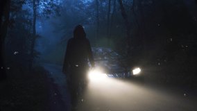 A sinister hooded figure standing in front of a car. On a spooky forest road on a foggy evening. With a glitch edit - Powered by Shutterstock - Get 15% off with code: PIKWIZARD15