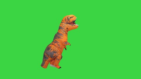 Dinosaur costume doing some funny walking on a Green Screen, Chroma Key.