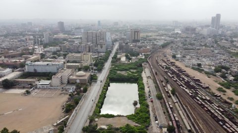 karachi pakistan 2021,  aerial footage of cityscape and landmarks of karachi city, aerial footage of II Chandigarh Road Karachi with train in at Karachi city Railway Station, Business hub of Pakistan