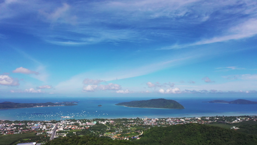 aerial panorama view Chalong gulf in blue sea. Loan island is close to Chalong pier.
Houses, buildings of Phuket Town.
Chalong marina is a center for intense boating activity, a Technology Video by thaisign