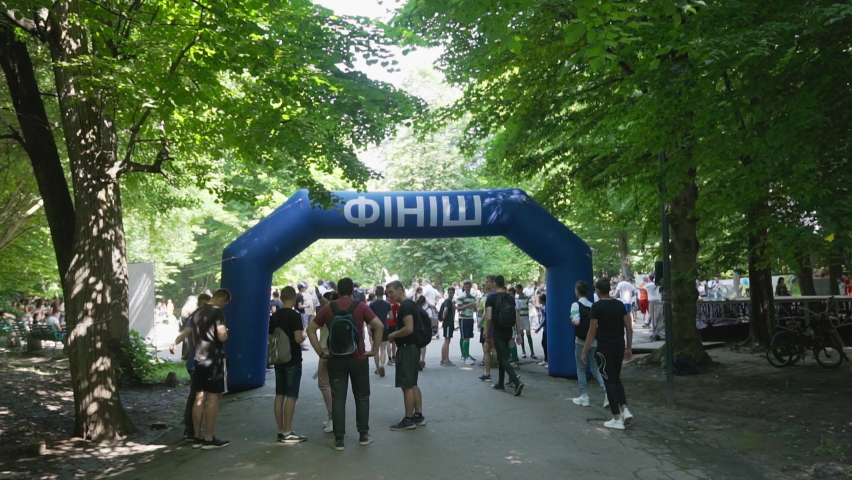 Chernivtsi, Ukraine - May 23, 2021: International Olympic Day. Inflatable ball in form of arch with inscription "finish" in Ukrainian. Object marks end of running route. End of sports distance