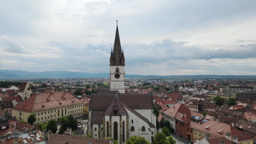 Aerial view of ancient part of Sibiu in Romania, red roofs town in summer day