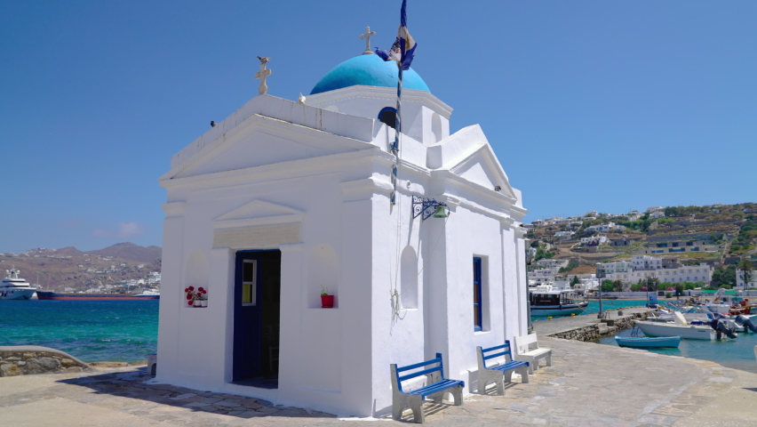 Whitewashed and blue domed Agios Nikolaos church in the Old Town of Mykonos, Greece