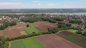 Aerial video of suburban settlement near siberian river Ob and town Novosibirsk. Siberia, Russia.