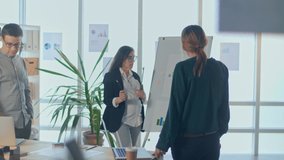 Successful Pregnant Woman, Working With Colleagues in Modern Office, Presents Data From the Financial Graph, Showing Information on a Whiteboard. Modern Working Woman in Late Pregnancy. - Powered by Shutterstock - Get 15% off with code: PIKWIZARD15