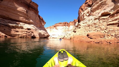 4K POV point of view kayaker paddling on the Lake Powell upstream towards the Navajo Lower Antelope Canyon on sunny day. Travel to the Navajo Lower Antelope Canyon , Arizona, USA-March 30, 2021