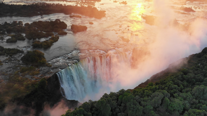 Sunrise aerial of Victoria Falls Zimbabwe Royalty-Free Stock Footage #1074930815