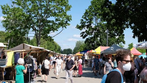 Berlin, Germany - June, 2021: People wearing face mask, outdoor on flea market at Mauerpark in Berlin