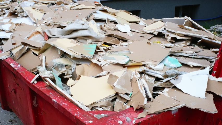 Pile of Hazardous Construction Materials Waste In Large Metal Garbage Dump Container Bin | Shutterstock HD Video #1074938408