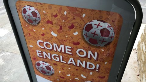 London, UK, June 26th 2021: A Soho supermarket with an entrance sign to support the England football team, reading Come on England! Static shot.
