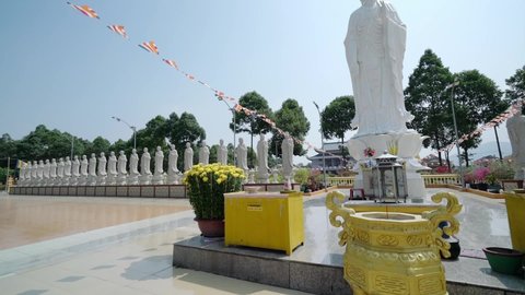 Vung Tau, Vietnam - February 24th, 2021: The Buddha is big and 49 small statue before temple courtyard, where organized Buddhist monks academy perform beings preaching in Vung Tau, Vietnam