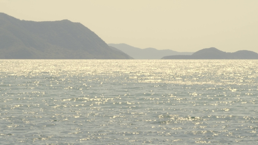 Sea waves and blue sky. Sea waving by wind. Static Camera recording. Ripple of blue sea. At Pattaya beach which one of famous sea location in Thailand. Represent vacation relaxing. Royalty-Free Stock Footage #1074960239
