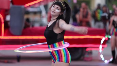 Reno, NV - USA - June 26 2021: Street Performers with Colorful Lighted Hula Hoops at the Sierra Arts Festival in Downtown.  Shallow Depth of Field