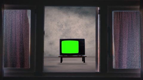 Old Television Inside Zoom In Window Entrance. Zoom In a vintage television with green screen inside a house.