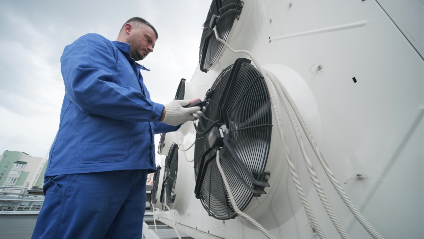 Testing with an anemometer of an axial fan of the condensing unit Royalty-Free Stock Footage #1074968114