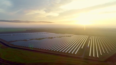 Beautiful view of the sun park at sunset. Solar collectors convert solar energy into thermal energy. Designing and maintaining power plants. High quality. 4k footage.