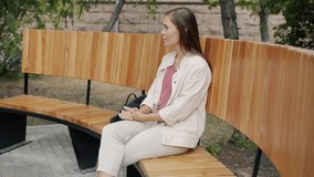 Cheerful disabled man in wheelchair is meeting girlfriend outdoors in park bringing flowers talking enjoying date together. Romantic relationship and disability concept. - Powered by Shutterstock - Get 15% off with code: PIKWIZARD15