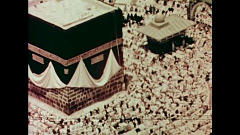 CIRCA 1973 - Muslims on their pilgrimage to mecca demonstrate both the traditional and modern aspects of Saudi Arabia.