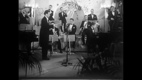 CIRCA 1940s - A jazz band begins "A Little Robin Told Me So" with the singing trio The Canadian Capers.