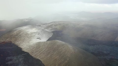 ICELAND - CIRCA 2020s - Aerial over snow covered lava flows at the Fagradalsfjall volcano on the Reykjanes Peninsula, Iceland.