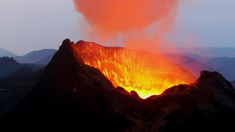 ICELAND - CIRCA 2020s - Slow motion explosion of lava in crater at the Fagradalsfjall volcano volcanic explosive eruption in Iceland.