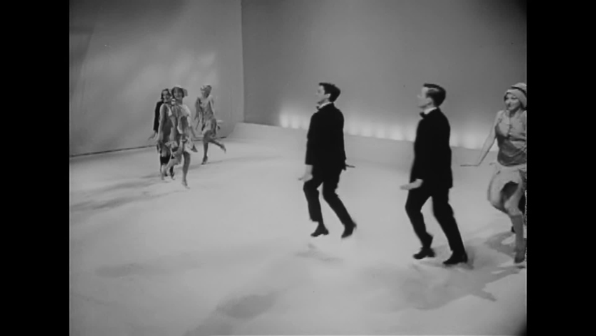 CIRCA 1956 - Men and women dance the Charleston in a theatrical revue.