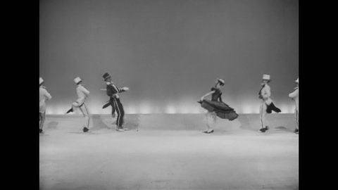 CIRCA 1956 - Dancers in 19th century costumes perform on a showboat.