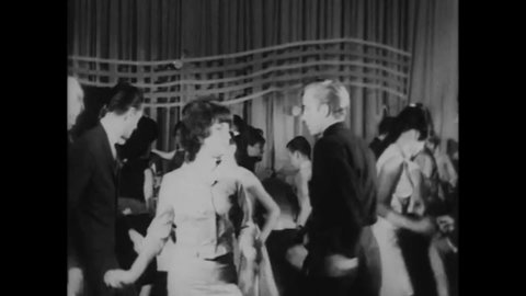 CIRCA 1964 - In this horror film, young people dance at a club unaware that a large furry monster is approaching.