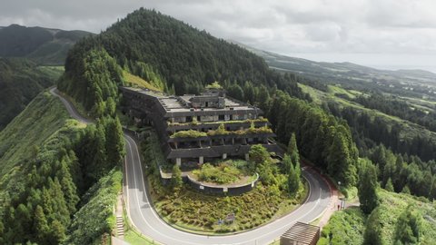 SAO MIGEL ISLAND, AZORES, PORTUGAL-14 MAY, 2021: Aerial view of Monte Palace hotel ruins on top of mountain with lake view, Cerrado das Freiras, Sao Miguel island, Azores ,Portugal, 4k footage