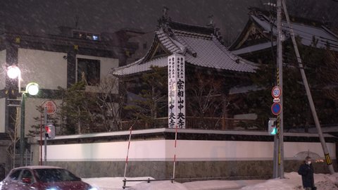 Sapporo, Japan - 03 01 2021: Japanese Shrine deep in snow in Sapporo, Hokkaido during winter