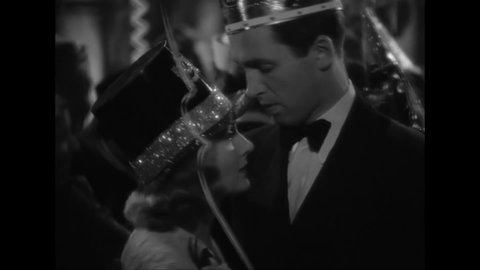 CIRCA 1939 - In this melodrama, a tearful woman walks away from her husband (Jimmy Stewart) on the dance floor at a New Year's Eve party.