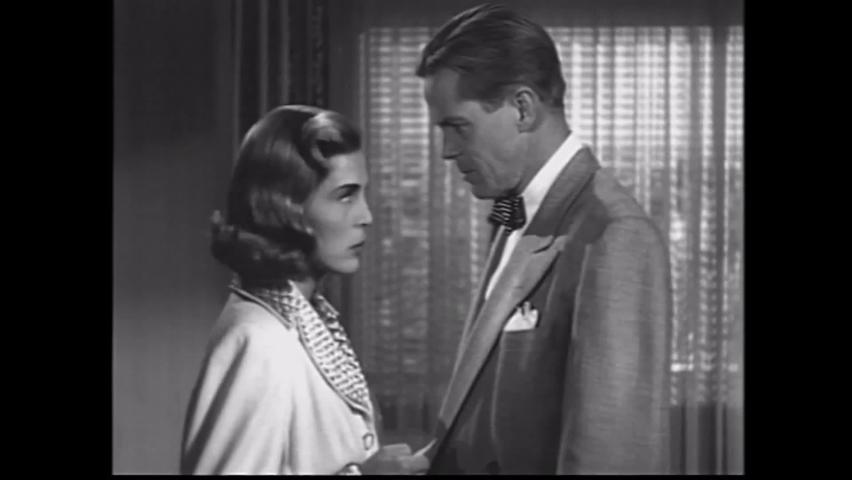 CIRCA 1949 - In this film noir, a criminal kisses his girlfriend but then is mean to her to remind her she's in a tough business now.