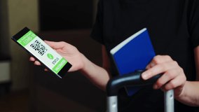 Vaccination passport on a mobile phone allowing travel in suitcase. Close up shot - Powered by Shutterstock - Get 15% off with code: PIKWIZARD15