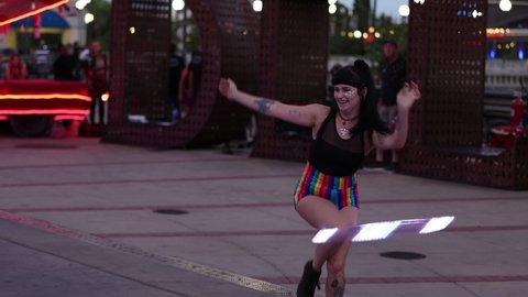 Reno, NV - USA - June 26 2021: Street Performer with Lighted Hula Hoop at the Sierra Arts Festival in Downtown.  Shallow Depth of Field