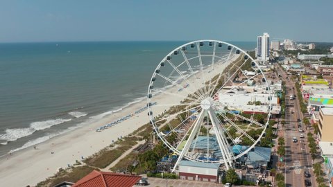 Myrtle Beach , SC , United States - 06 15 2021: Aerial of SkyWheel amusement park attraction at oceanfront vacation destination, Myrtle Beach, South Carolina.