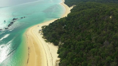 Flying along the coast of Moreton Island, Shipwrecks on the left, Queensland Australia. Drone footage