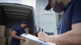 Video of couriers unloading packages and checking documents. Shot with RED helium camera in 8K.