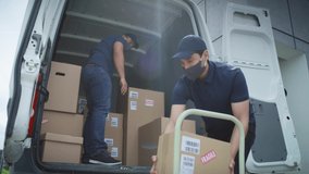 Video of two couriers in protective masks unloading packages. Shot with RED helium camera in 8K.