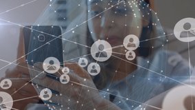 Animation of network of digital icons over woman using smartphone. global social media, digital interface, technology and networking concept digitally generated video. - Powered by Shutterstock - Get 15% off with code: PIKWIZARD15