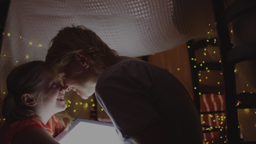 Animation of mother and daughter reading with camera recording screen. digital interface and technology concept digitally generated video.