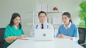 50p frame rate footage of team of Asian doctors are consulting patients online.
