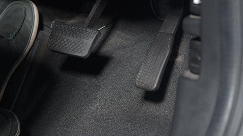Car foot pedal. Accelerator and break pedal in a car. Close up the foot pressing foot pedal of a car to drive. Driver driving the car by pushing accelerator pedals of the cars. inside vehicle. auto.