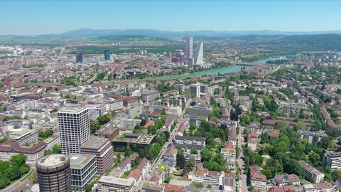 Basel: Aerial view of city in Switzerland at border with France and Germany, knee of river Rhine in center of city, clear blue sky - landscape panorama of Europe from above