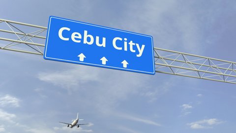 Airplane flies over Cebu city city road sign