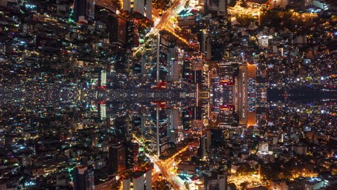 Abstract hyperlapse footage of flight over downtown at night. Infinite rows of city lights. Horizontal mirror effect. Mexico City, Mexico.