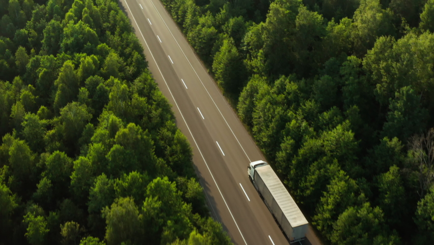 Road transport truck industry forest nature highway car delivery Royalty-Free Stock Footage #1075066196