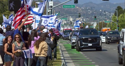 LOS ANGELES, CALIFORNIA, USA - MAY 23, 2021: Israel supporters protest against Palestinian Hamas, a militant terrorist group governing Gaza, Beverly Hills, Los Angeles, California, 4K