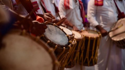 close up of people playing percussion drum in India. Music instrument chende is a percussion instrument used for beats and widely used in Karnataka, Kerala and Tamil Nadu in India.