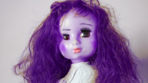 Scary Ugly Purple Doll Shaking Head Stock Footage Video (100% Royalty