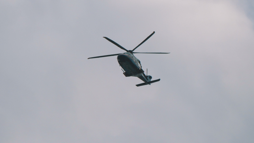 Helicopter flight on the sky in 4k slow motion 60fps